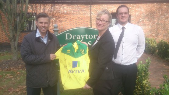 Gary Lee from Iconic wins the signed Norwich City Football s...